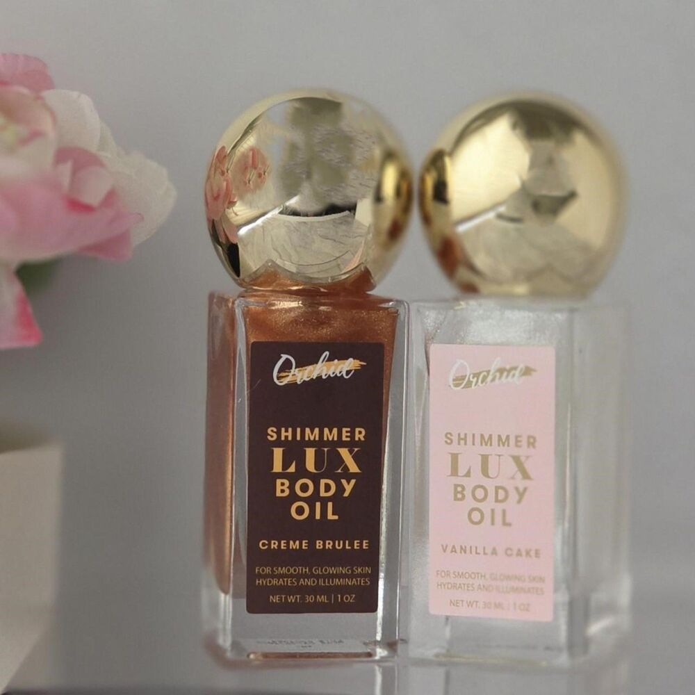 Set of two Orchid Shimmer Lux Body Oils in sweet gourmand scents.
